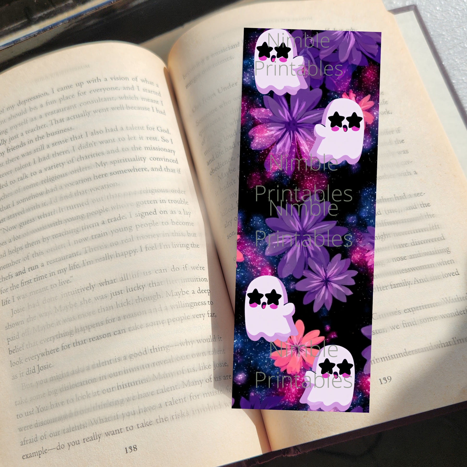 Bookmark with cartoon ghosts, purple flowers, and galaxy background.