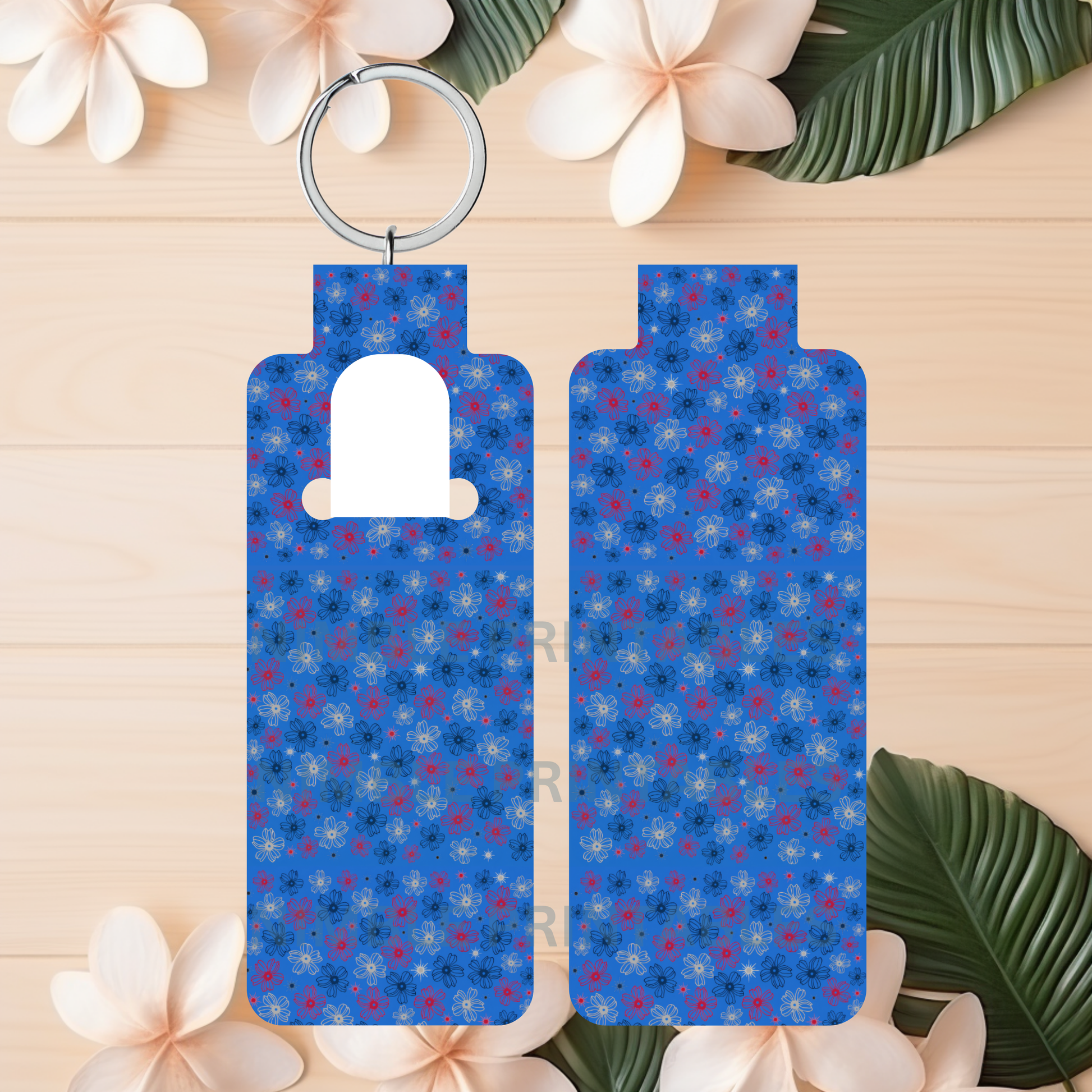 Blue keychain with floral pattern and white space for customization.