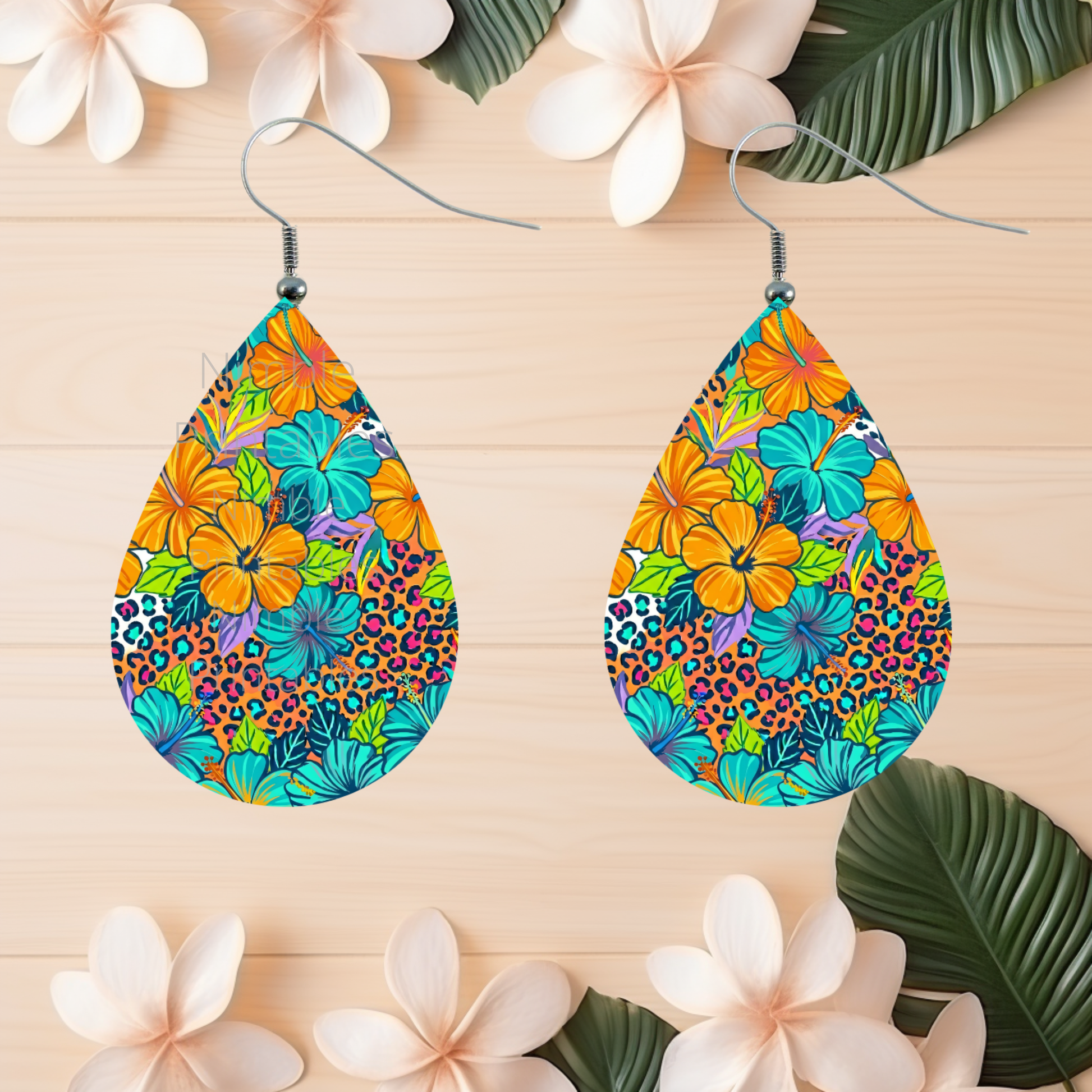 Teardrop earrings with tropical floral and leopard print patterns.