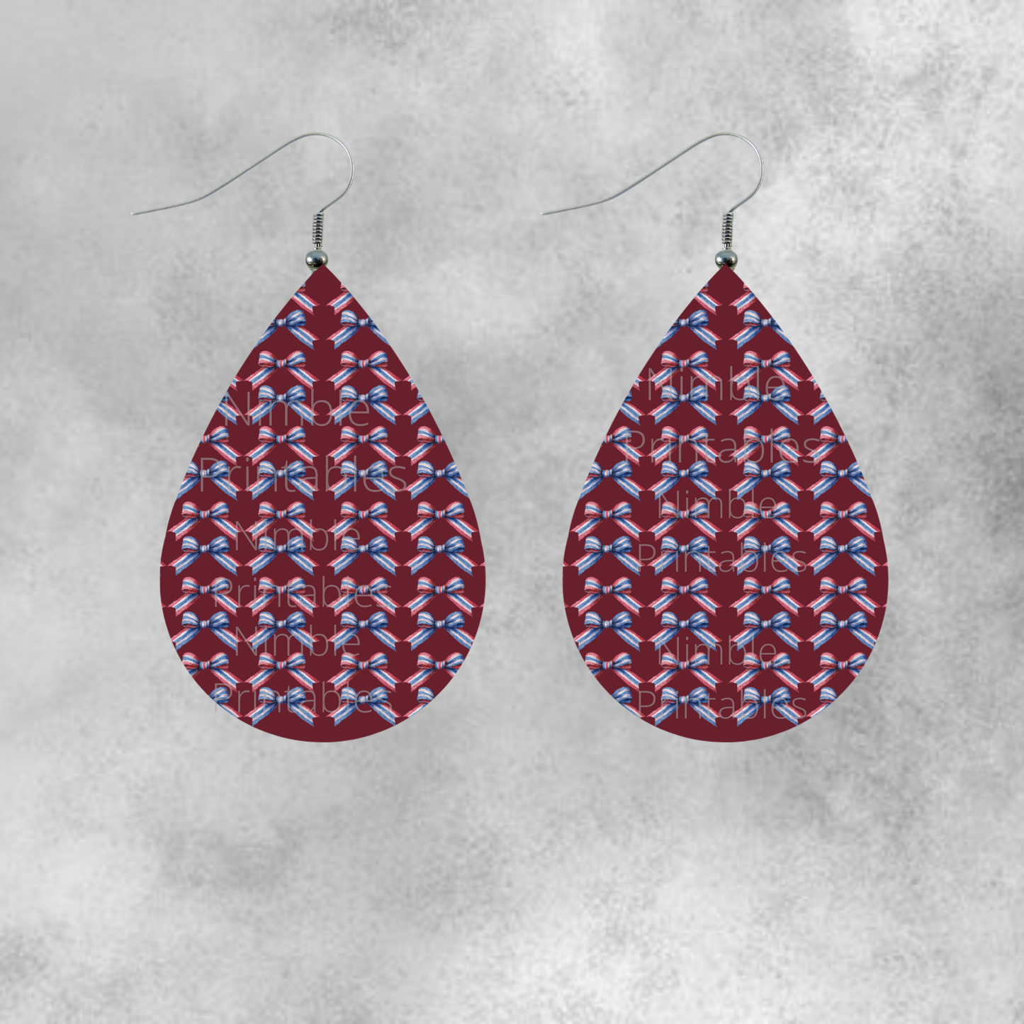 Teardrop earrings with a pattern of red, white, and blue bows.