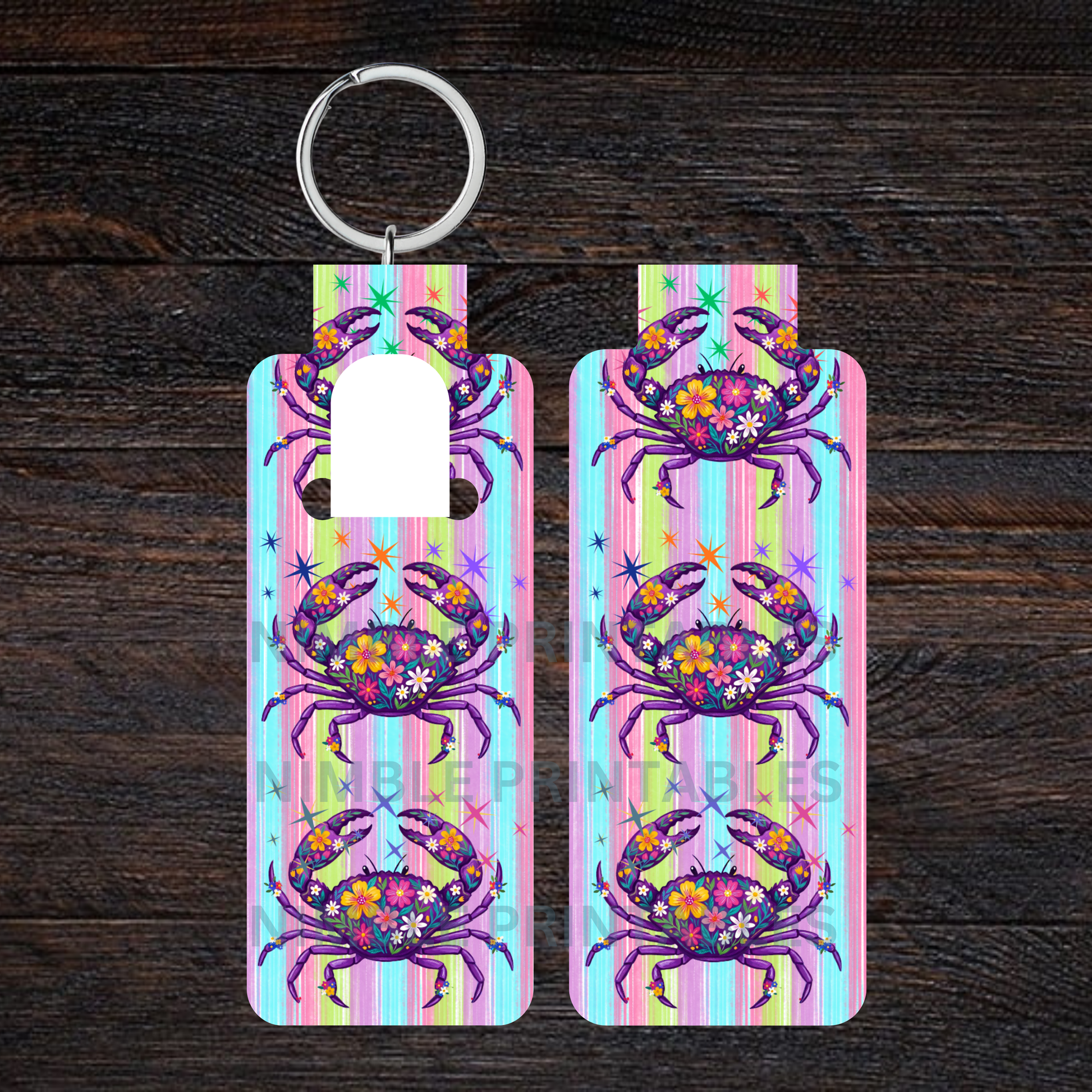 Two colorful hand sanitizer keychains with a floral crab design.