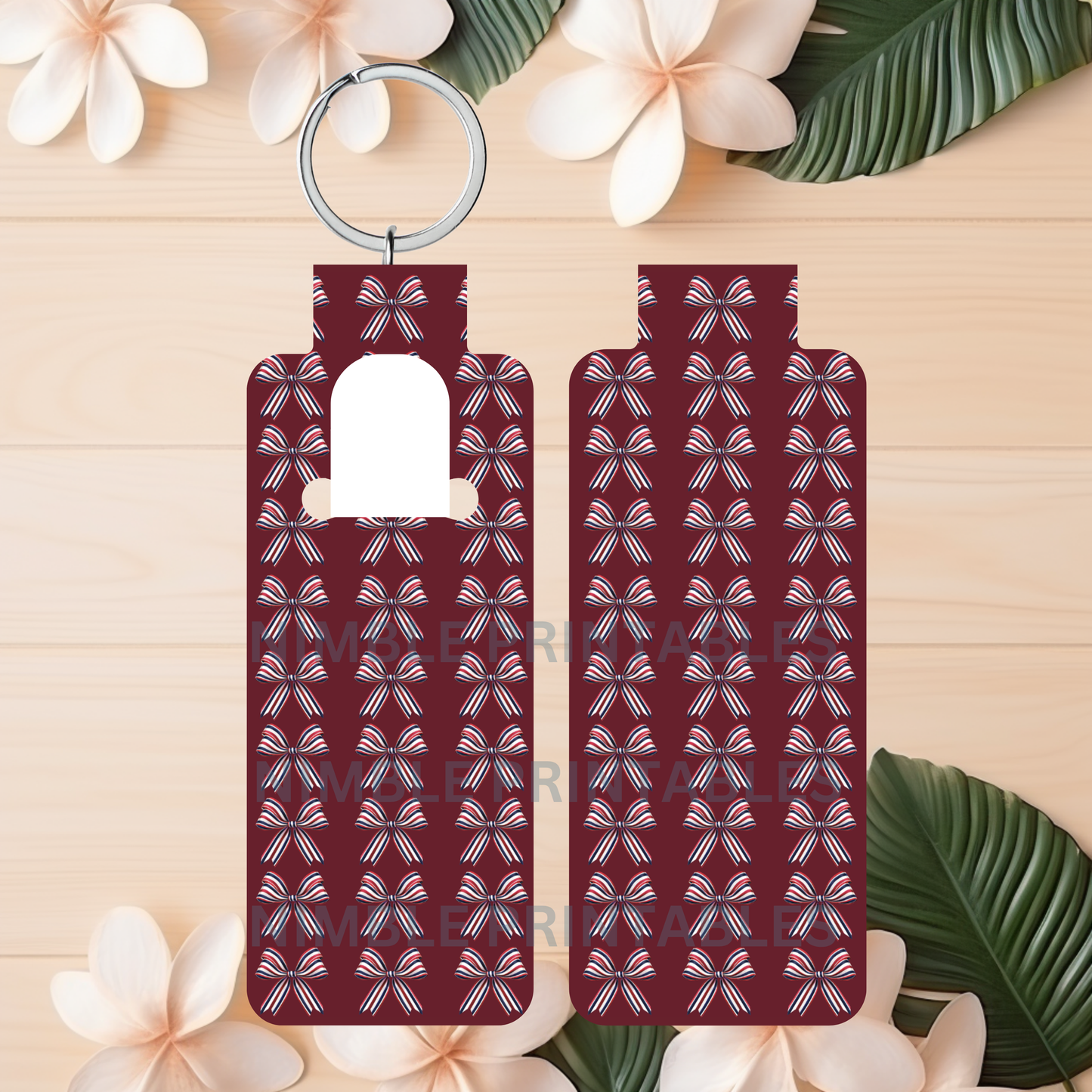 Two keychains with red, white, and blue bow pattern on wooden background.
