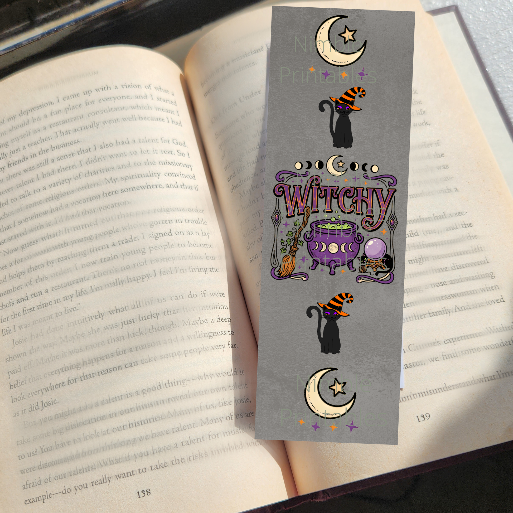 Halloween bookmark with black cats, witch hats, cauldron, and moon phases.
