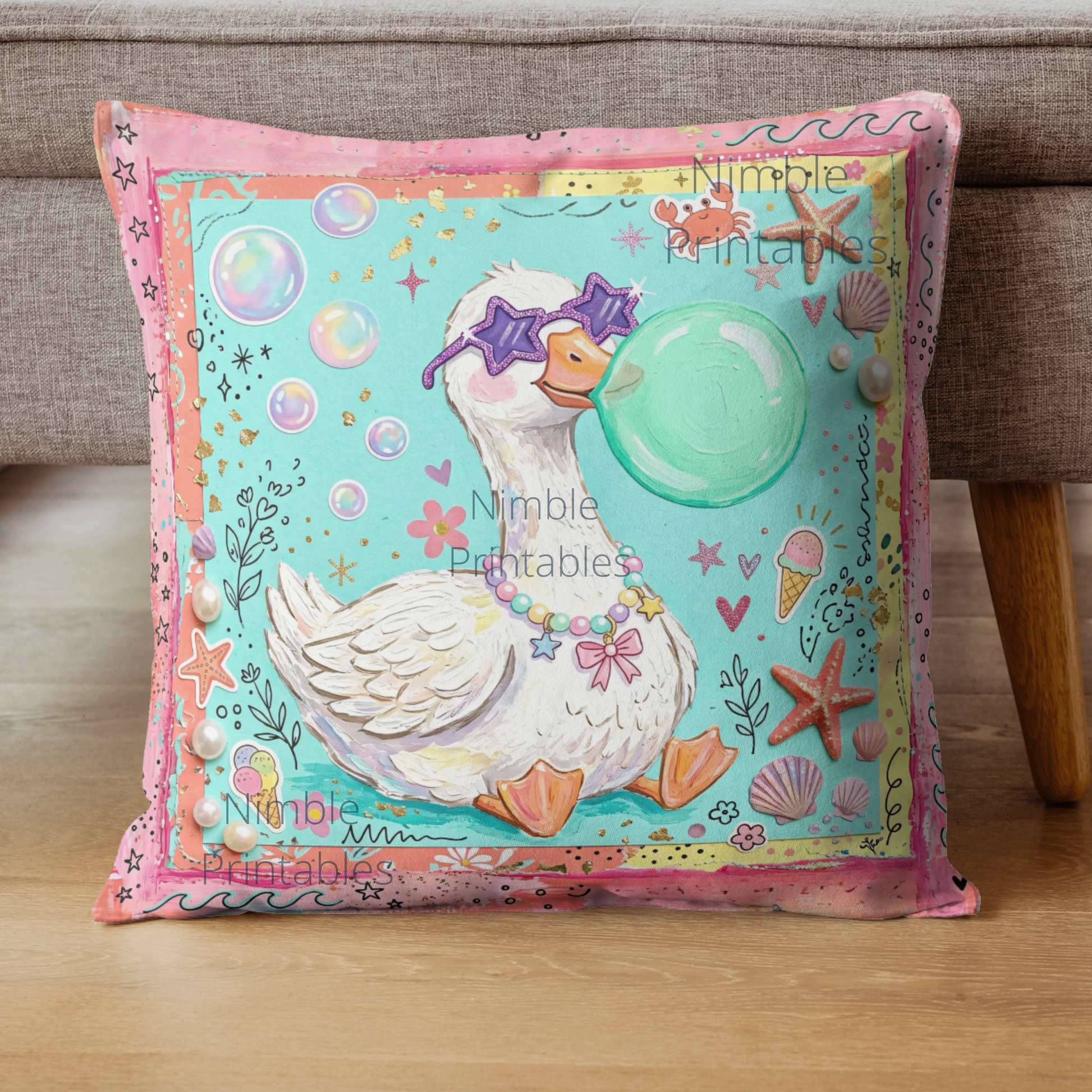 Duck wearing sunglasses blows a bubble on a beach-themed pillow.
