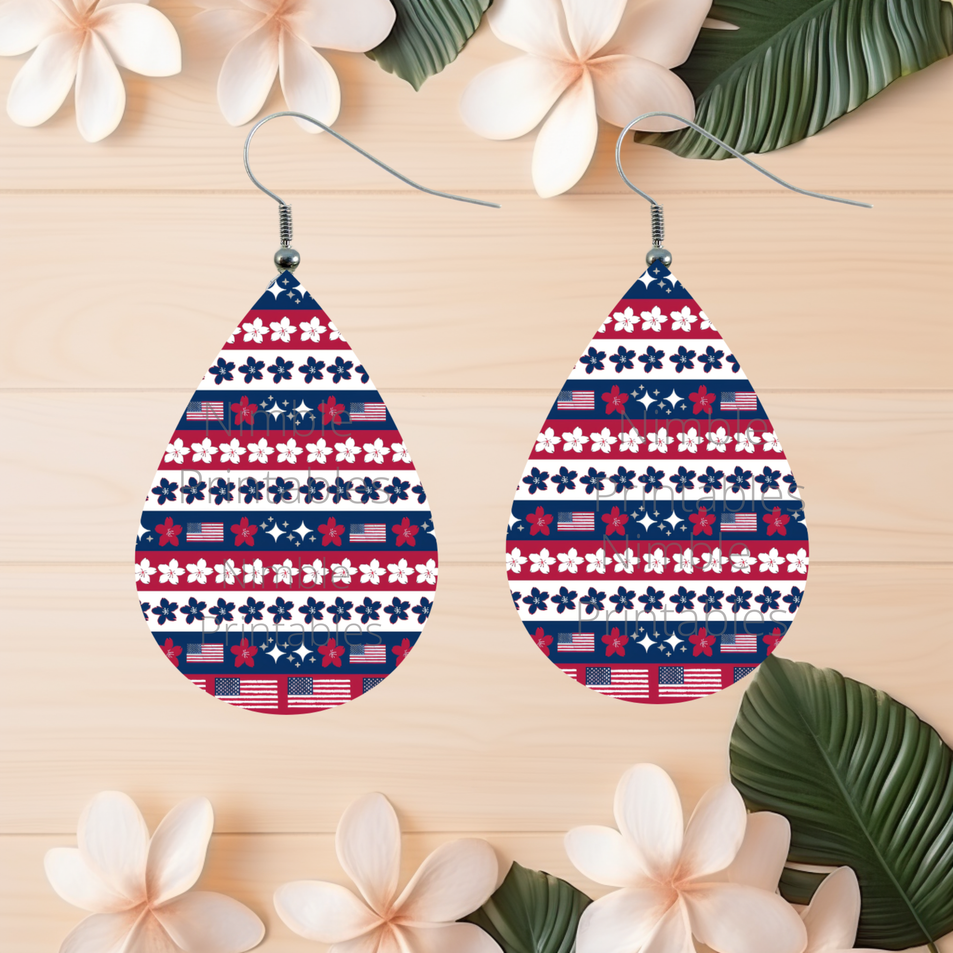 Teardrop earrings with red, white, and blue floral and flag pattern.