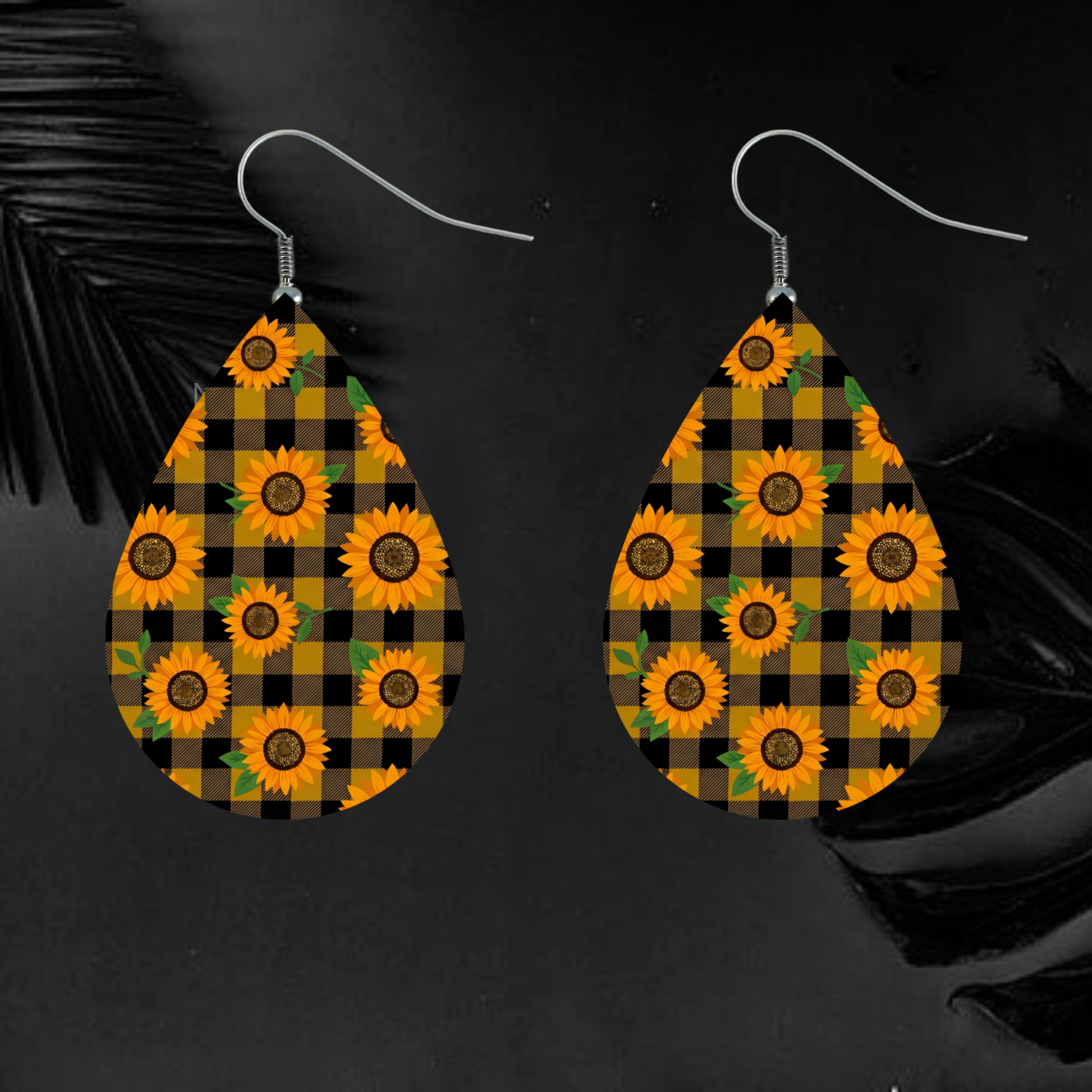 Teardrop earrings with sunflowers on buffalo plaid pattern.