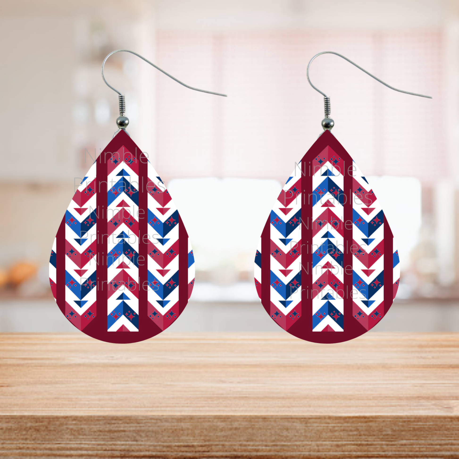 Tear-drop shaped earrings with red, white, and blue chevron pattern.
